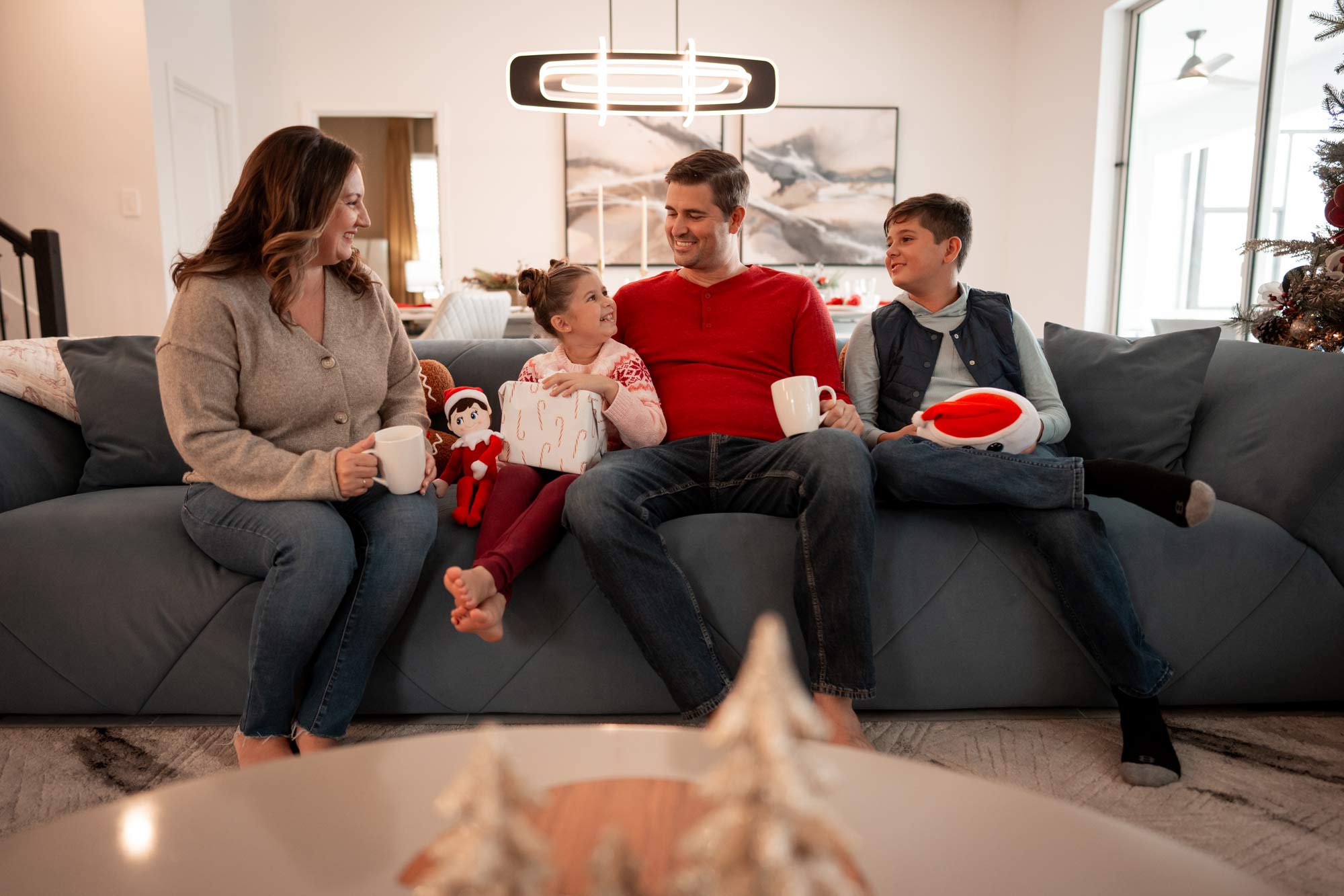 family sitting on a couch in a villa