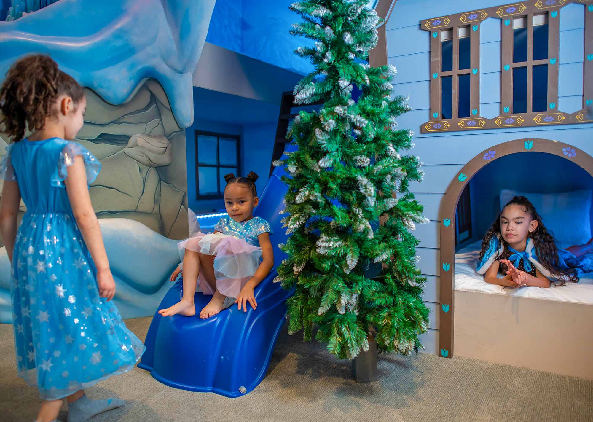 girls playing in a Frozen themed bedroom