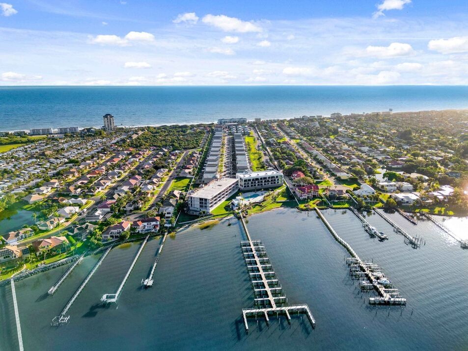 aerial view of harbor island with dock and boat slips