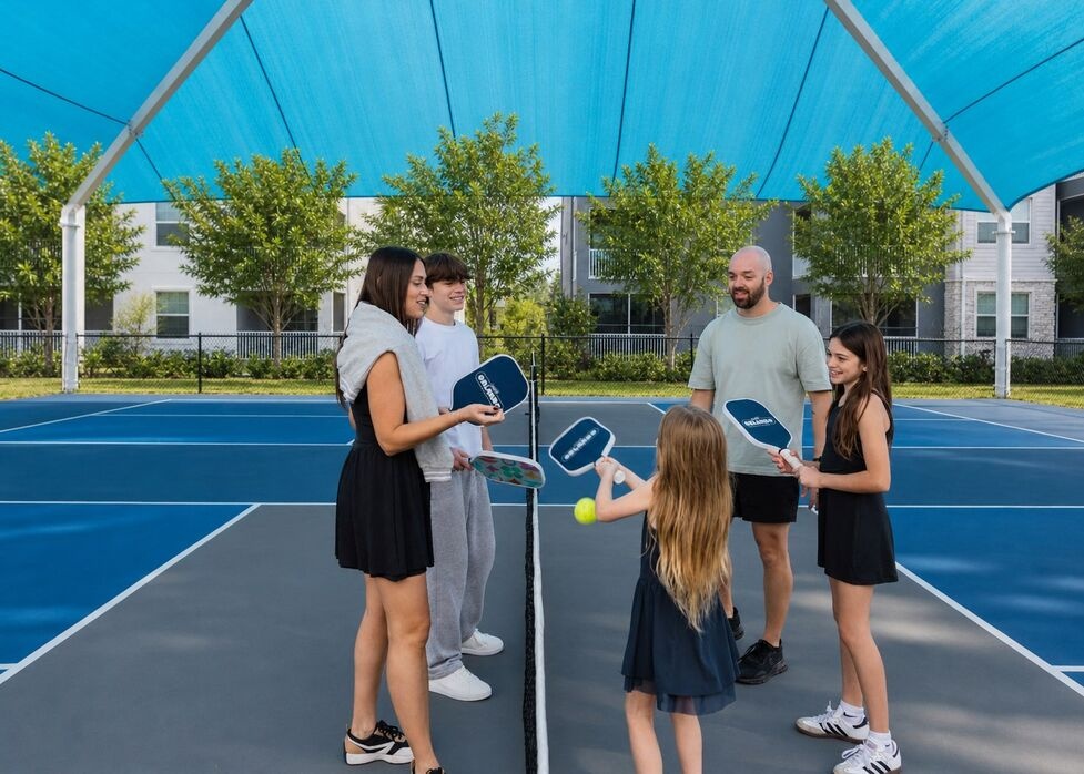 family on a pickleball court