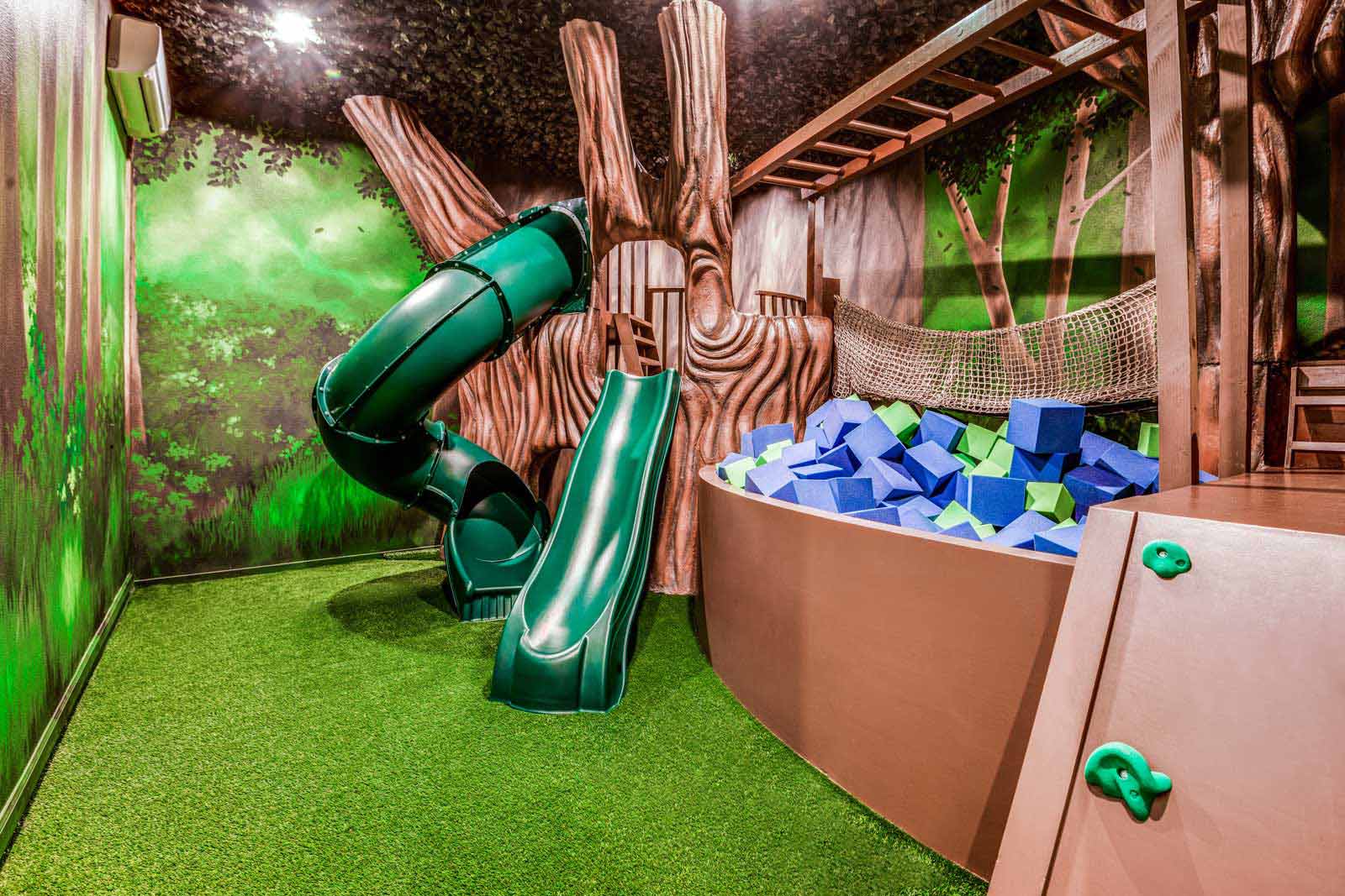kid's game room with foam pit and slide for passover orlando at villatel village